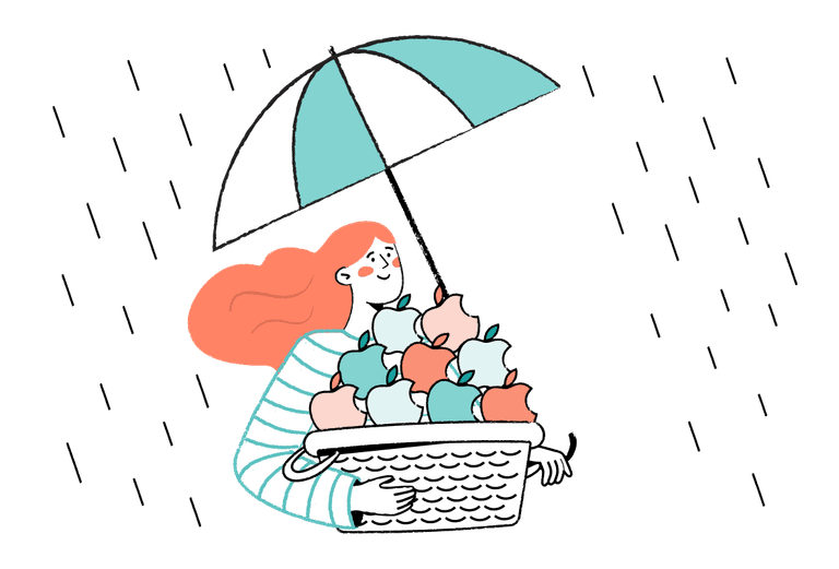 Woman holding a basket of apples and an umbrella in the other hand