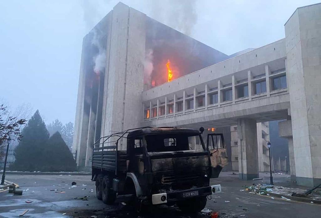 Cost of Internet Shutdowns 2022 tracker hero image showing burning public building during Kazakhstan protests