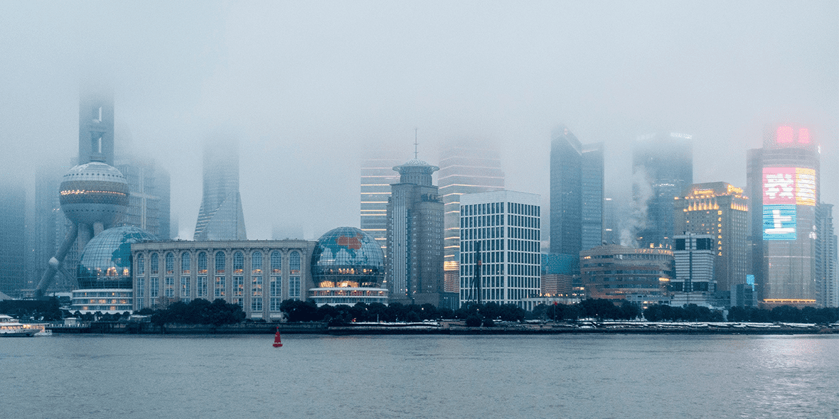 Chinese cityscape with skyscrapers obscured by fog Chinese cityscape with skyscrapers obscured by fog