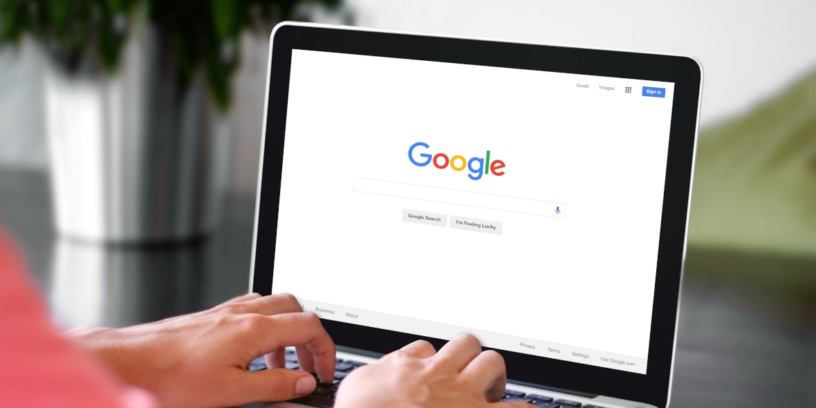 Person Using Google Search Engine on a Laptop Computer Person Using Google Search Engine on a Laptop Computer