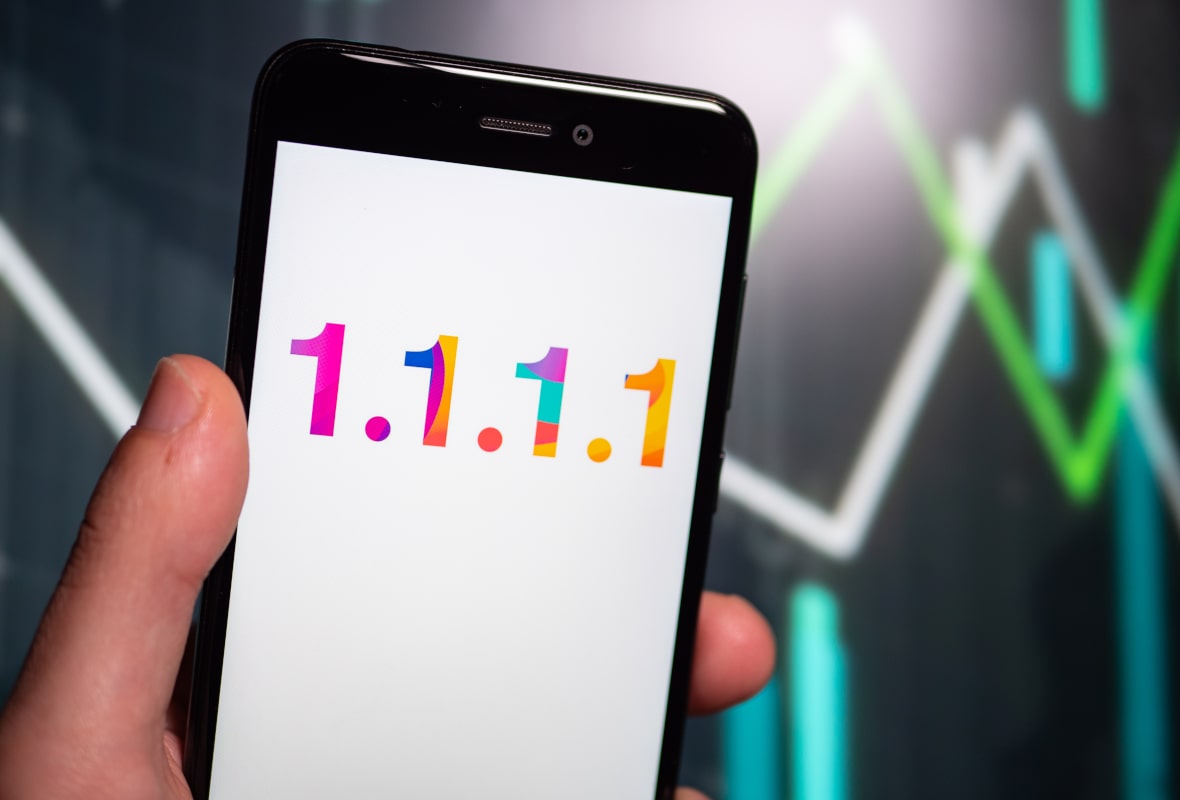 Person Using 1.1.1.1. DNS App on Mobile Device Person Using 1.1.1.1. DNS App on Mobile Device