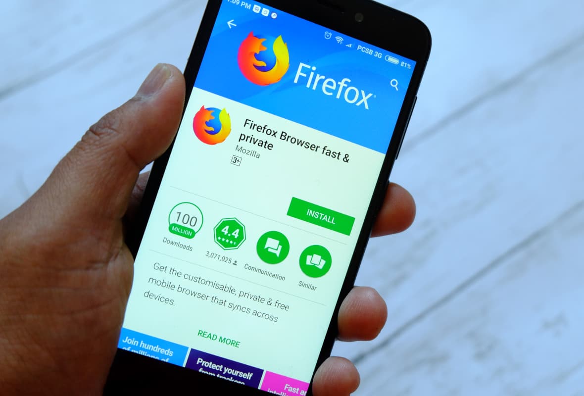 Person Holding a Phone With Firefox App Displayed on the App Store Person Holding a Phone With Firefox App Displayed on the App Store