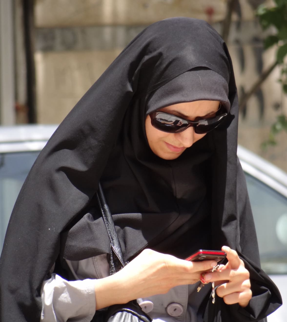 Iranian woman checking messages