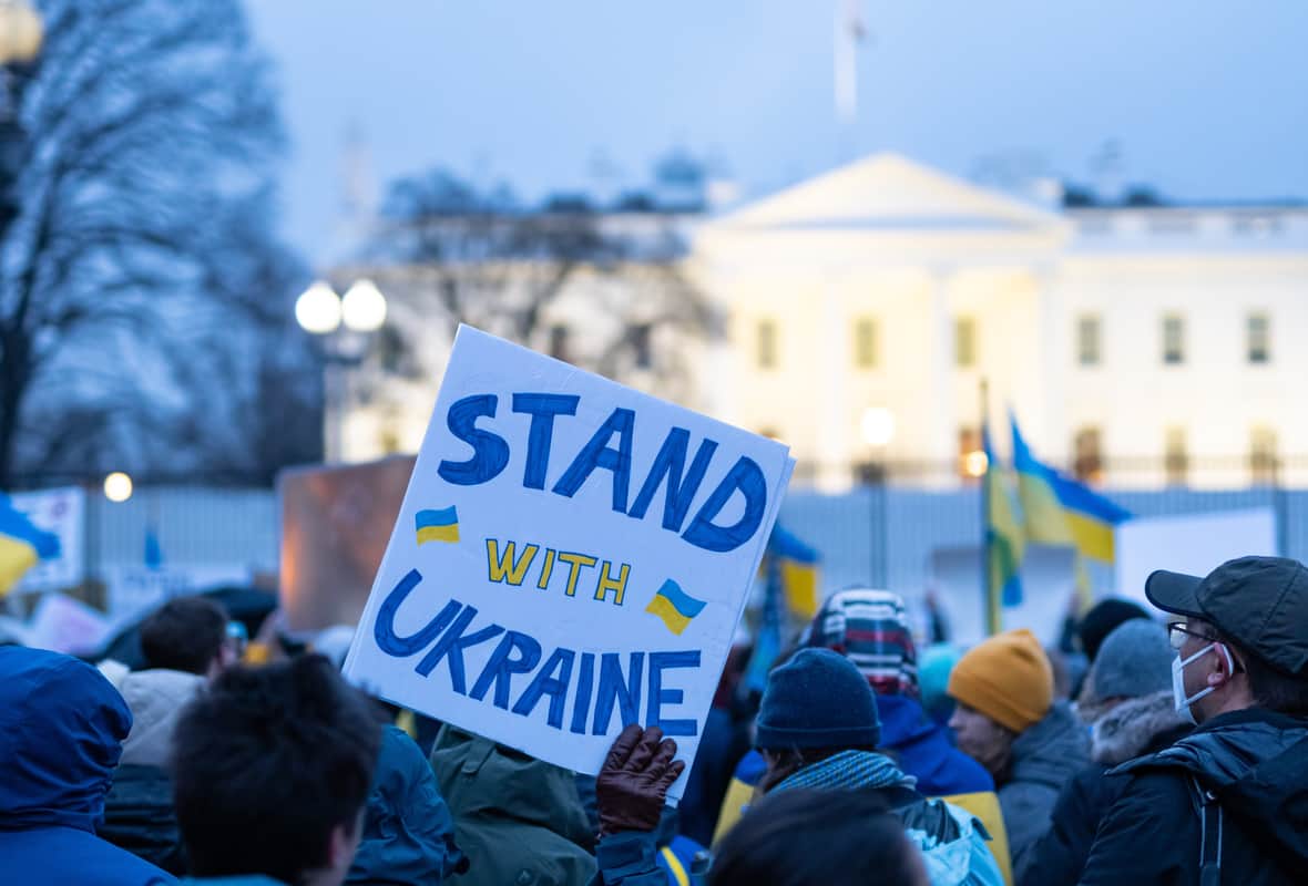 Russian cybersecurity, surveillance and telelcoms firms report main image showing anti-war protesters supporting Ukraine in Washington DC